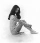 Nancy Kwan Sitting with Arms Wrapped Around Knees Photo Print.