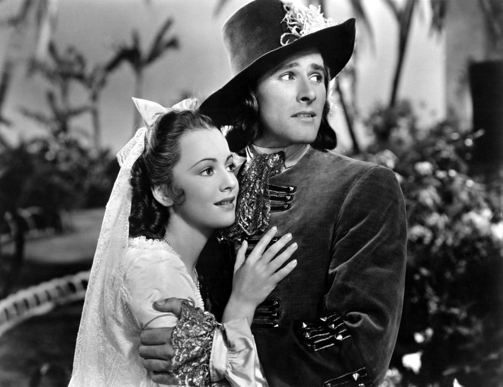 Captain Blood movie poster masterprint featuring Errol Flynn and Olivia De Havilland.
