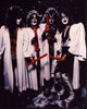 Kiss band photo print in white robes with red candles.