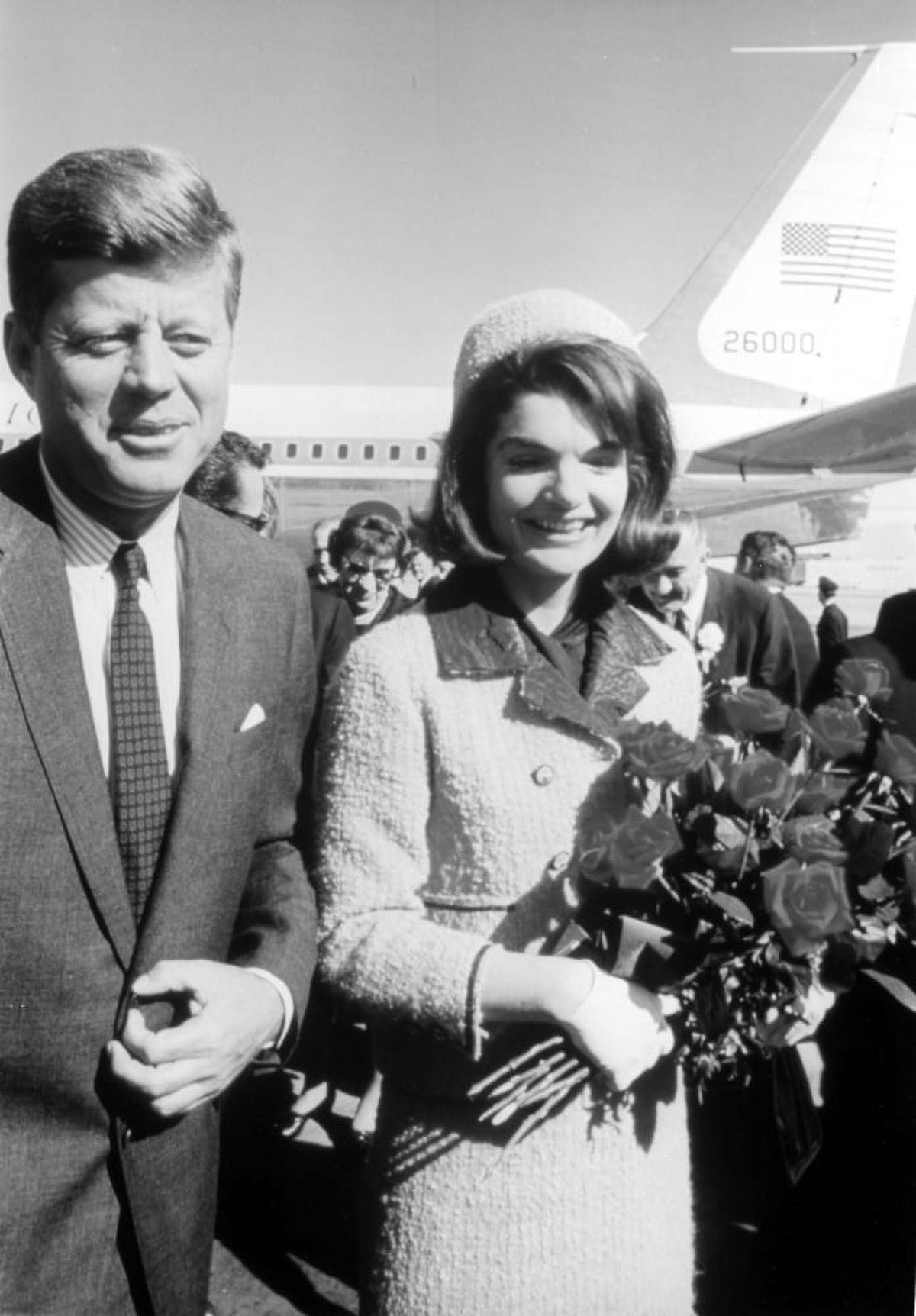 John F. Kennedy and Jackie Onassis holding flowers photo print