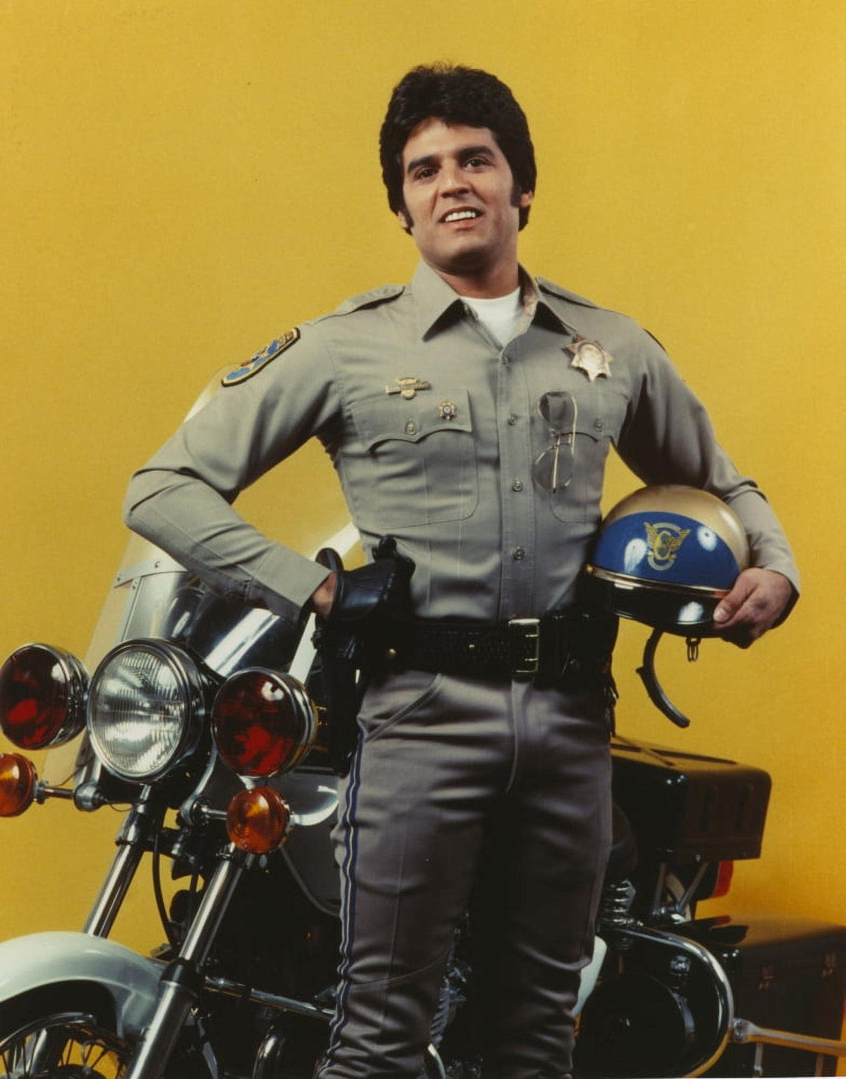 Erik Estrada holding helmet in police uniform photo print