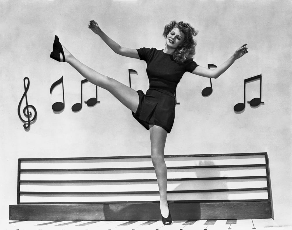 Rita Hayworth Dancing in Dress Photo Print showcasing vintage Hollywood charm.