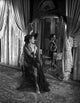 Yvonne DeCarlo looking behind in elegant black dress - black and white photo print.