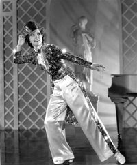 Eleanor Powell dancing in a glittering top with a magician's hat photo print.
