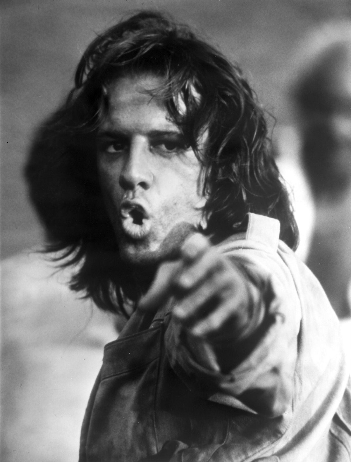 Film still photo print of Christopher Lambert pointing.
