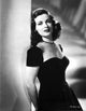 Joan Bennett portrait photo print leaning on a post in vintage style