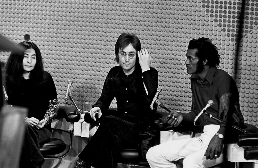 Photo print of John Lennon, Yoko Ono, and Chuck Berry.