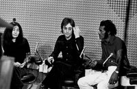 Photo print of John Lennon, Yoko Ono, and Chuck Berry.