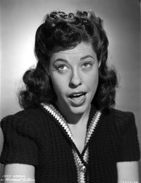 Classic portrait photo print of Judy Canova wearing a cap-sleeve dress.