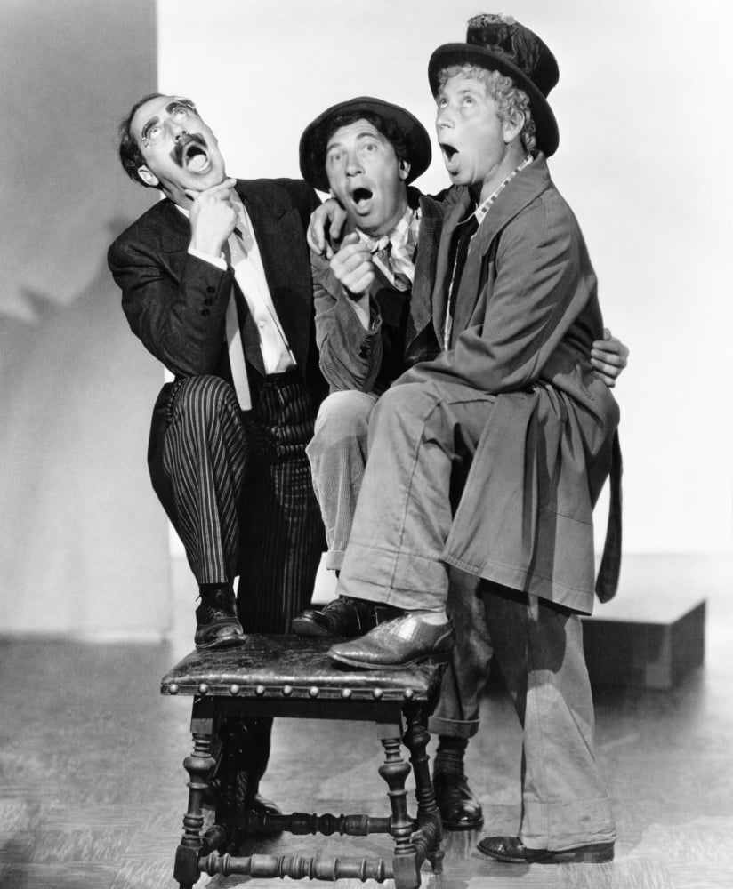 A Night At The Opera photo print featuring Groucho Marx, Chico Marx, and Harpo Marx.