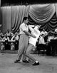 Vintage photo print of Martin and Lewis with a band
