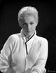 Kim Novak portrait photo print in white sweater on black background.
