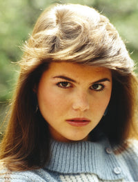 Lori Loughlin photo print wearing a knitted blouse and red lipstick.
