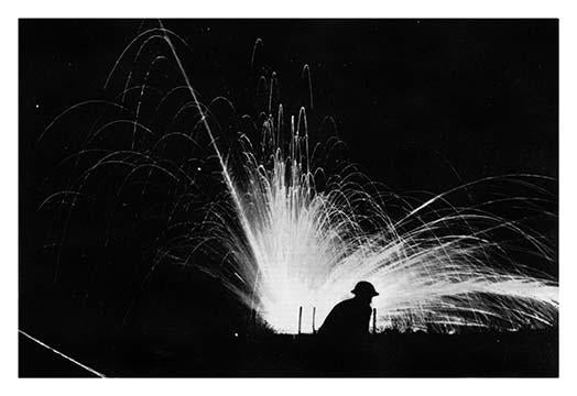 Night Attack with Phosphorus Bombs poster print by Sgt. J.J. Marshall, showcasing a soldier silhouette against phosphorous explosions.