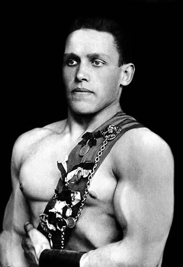 Photographic postcard print of Russian wrestlers showcasing ideal male body shape.