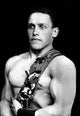 Photographic postcard print of Russian wrestlers showcasing ideal male body shape.