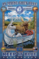The Blue Donkey rests in a boat surrounded by mountains and a moose in Maine.