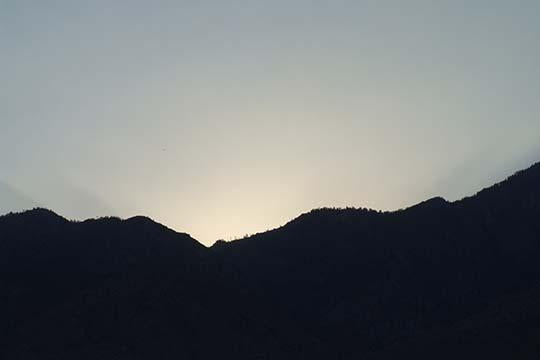 Desert sunset poster print featuring mountains and warm hues by Jason Pierce.