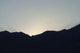 Desert sunset poster print featuring mountains and warm hues by Jason Pierce.