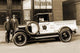 Vintage truck advertisement poster print showing early truck in front of tire store.