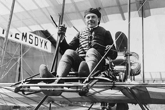 Mikhail Effimov seated on airplane full-length portrait poster print.