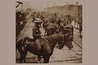 Poster print of a crowded scene with horses and riders disembarking from trains at Tampa.