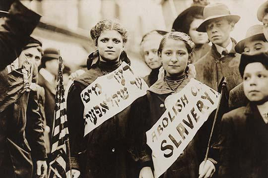 Historical labor parade poster print featuring two girls with banners and American flag.