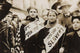 Historical labor parade poster print featuring two girls with banners and American flag.