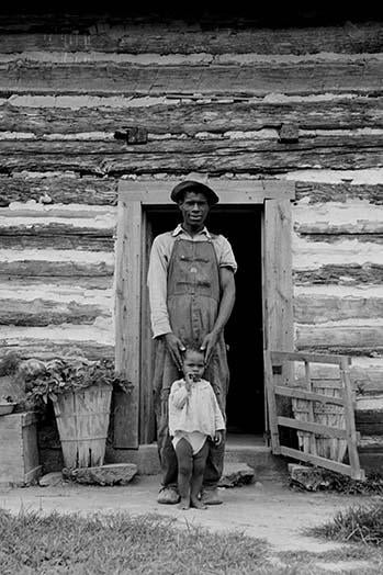 Young sharecropper with his first child Hillside Farm Poster Print by Dorothea Lange