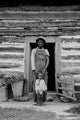 Young sharecropper with his first child Hillside Farm Poster Print by Dorothea Lange