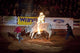Bull jumping through a flaming hoop at the Southeastern Livestock Exposition Championship Rodeo poster print.