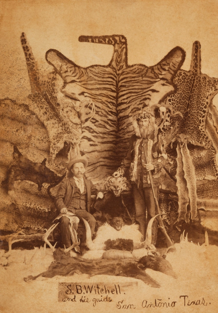 Studio photograph of Texas Ranger Robert Hall by D. P. Barr, featuring animal skins and rifle.
