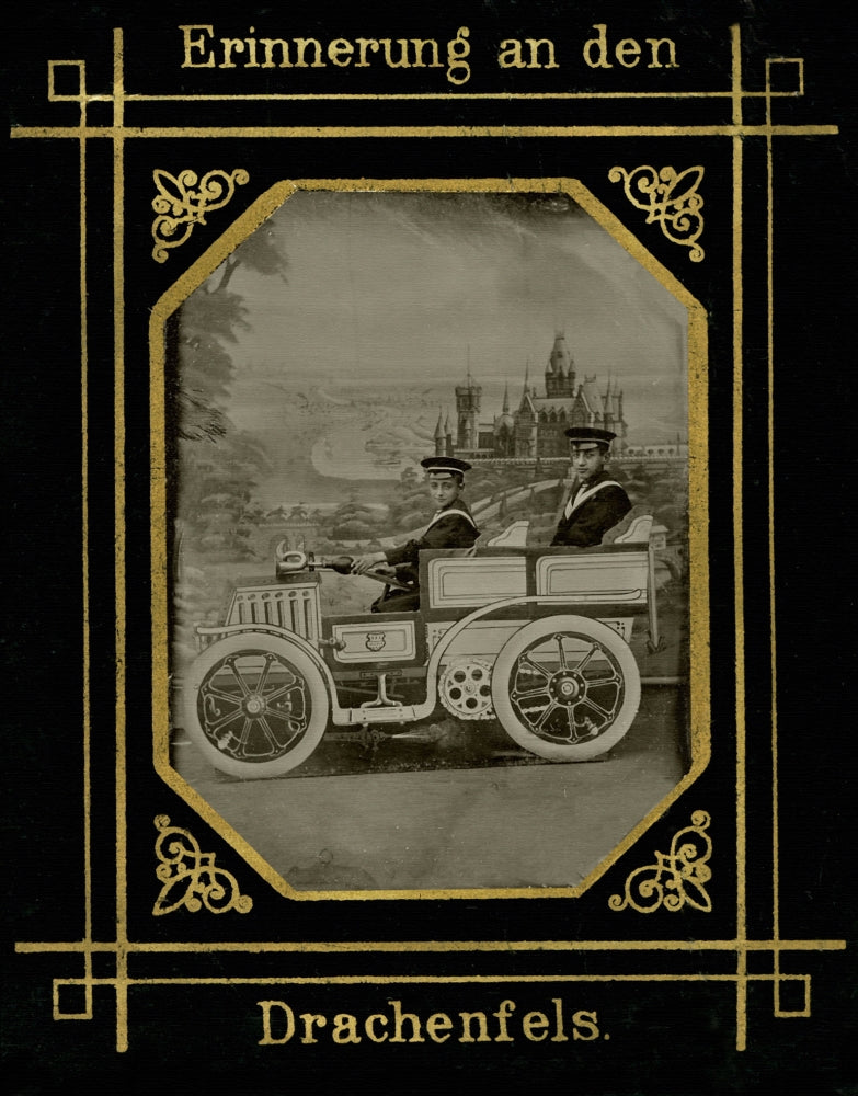 Drachenfels Castle poster print featuring two sailors in an antique car