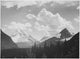 In Glacier National Park poster print by Ansel Adams depicting lush forests and mountains.