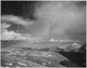 Mountain tops and low hanging clouds poster print by Ansel Adams showcasing Rocky Mountain National Park.