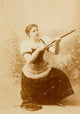 San Francisco Cowgirl with Rifle Poster Print showcasing a young girl with a prop rifle.
