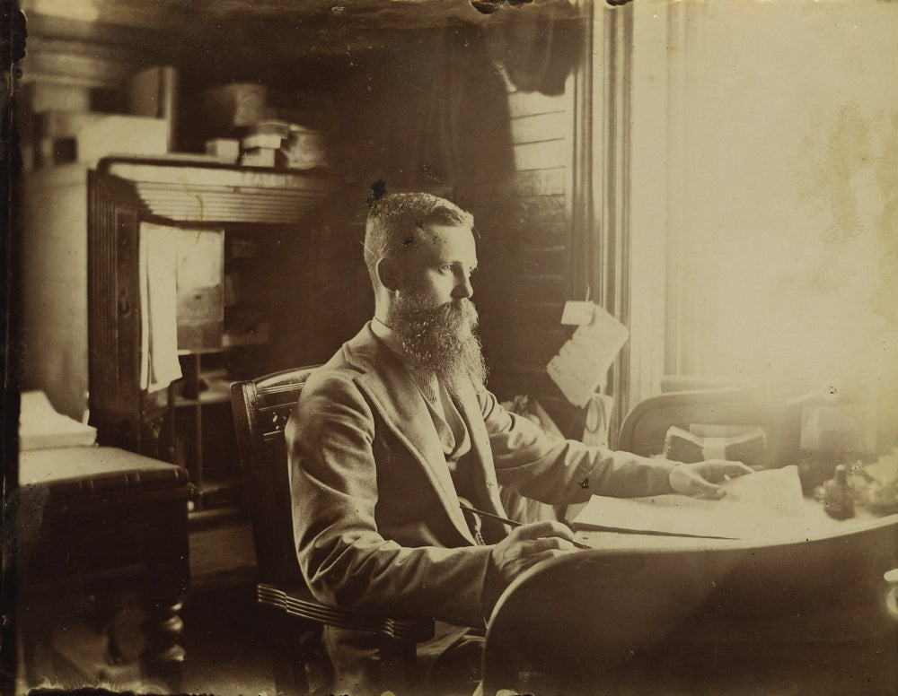 Wells Fargo & Company's Express Office poster from 1898, featuring a gentleman at a desk with a large open safe and currency.