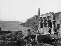 Man standing among temple ruins on the Island of Philae, Egypt poster print