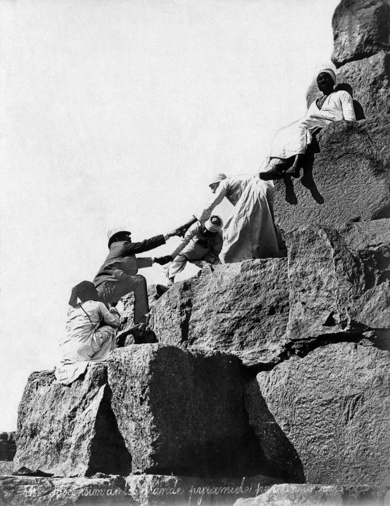 Tourist Climbing the Great Pyramid of Cheops Poster Print by Felix Bonfils