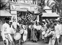 Procession in Colombo Poster Print by John Hoffmeister showcasing vibrant cultural celebration.