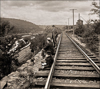 Men Sit Beside Tracks Taking Notes Poster Print on premium paper.
