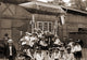 Festival Procession with Toy Zeppelin Poster Print showcasing a vibrant festival scene.