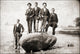 Young Men Stand on a Boulder Poster Print showcasing youth and adventure.