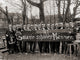 College Students Behind a Sign Poster Print showcasing vibrant campus life.