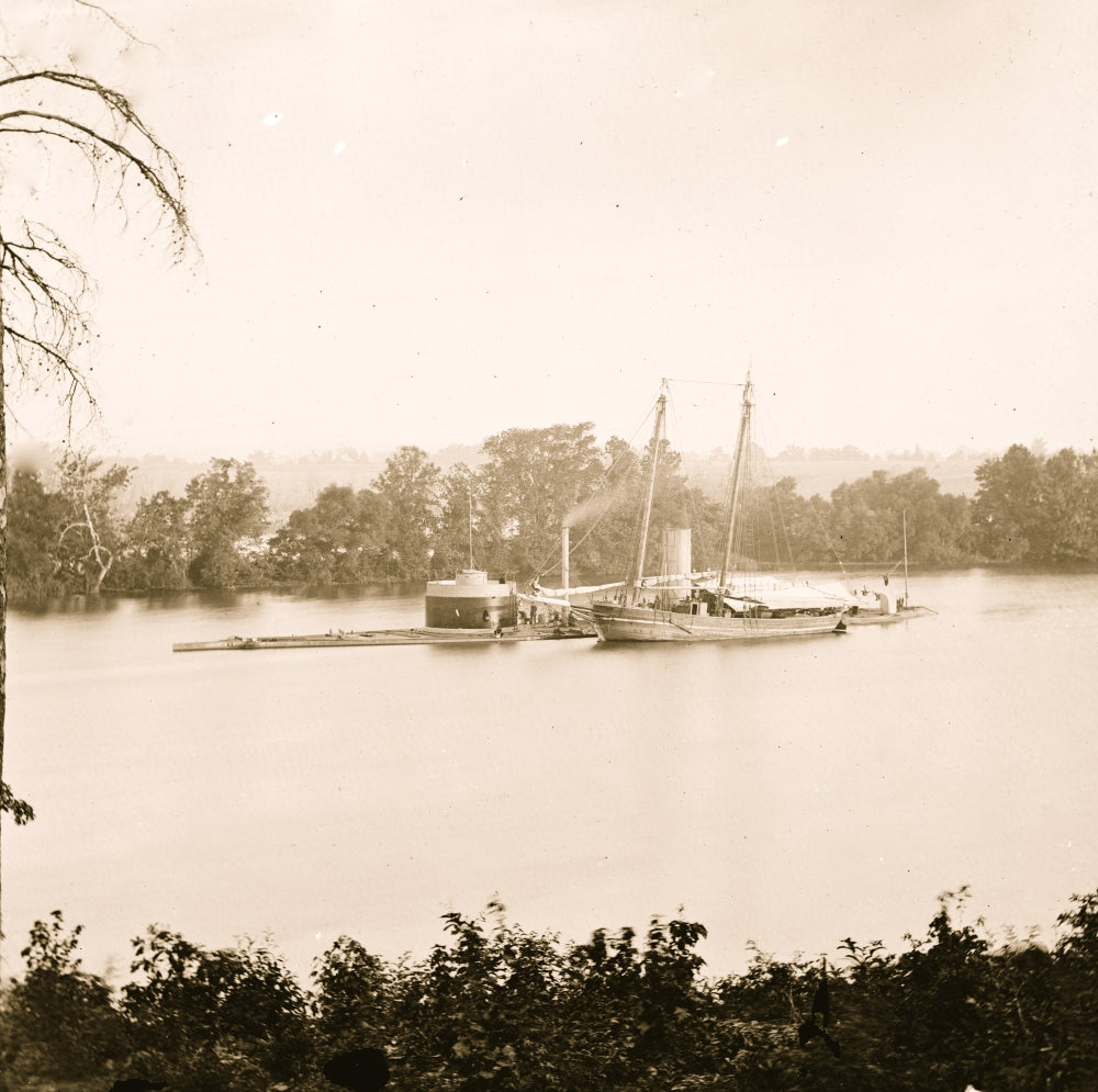 U.S. Monitor CANONICUS taking on coal from a schooner poster print.