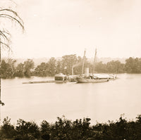 U.S. Monitor CANONICUS taking on coal from a schooner poster print.