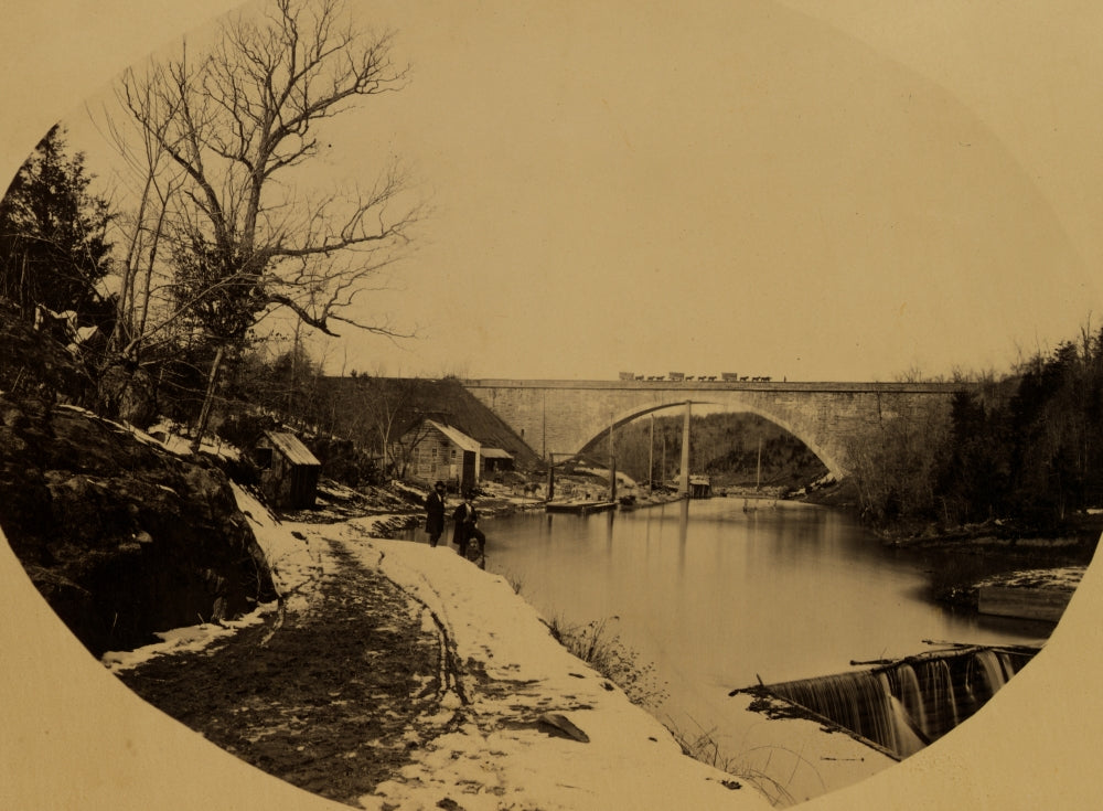 Poster print of two men standing near the Washington Aqueduct with Cabin John Bridge in the background.