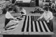 Flags laid out on cutting table for American ensigns during the Great War.