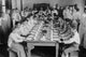 Naval Cadets at Newport sitting in disciplined formation before a meal.