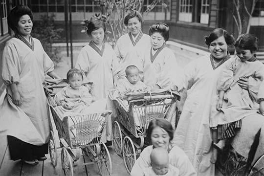 Traditionally Costumed Japanese Mothers with Infants in Baby Carriages Poster Print